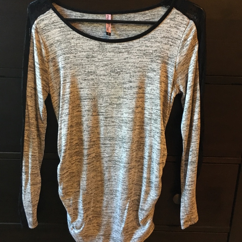Grey top with lace sleeves.